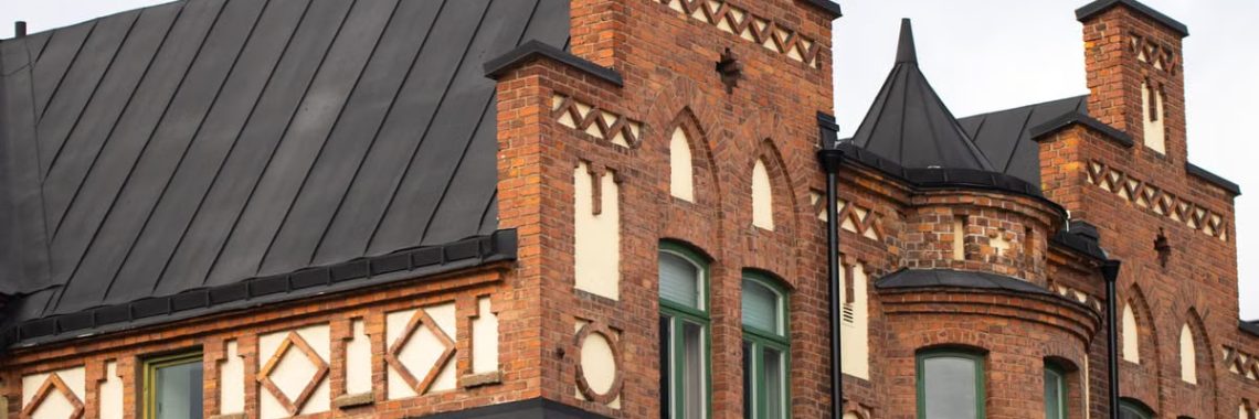 Close-up of a historic brick building featuring unique architectural elements.